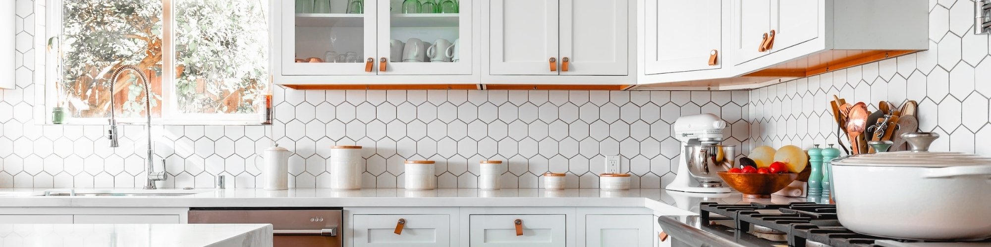 Modern white tile backsplash in a bright and open kitchen